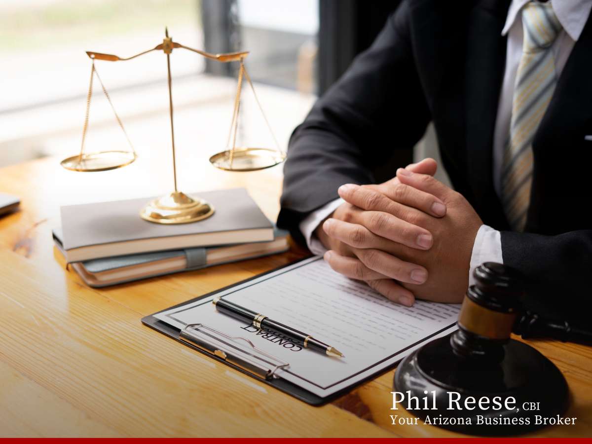 Business broker with scales of justice on desk, representing fair negotiations for business buyers & sellers